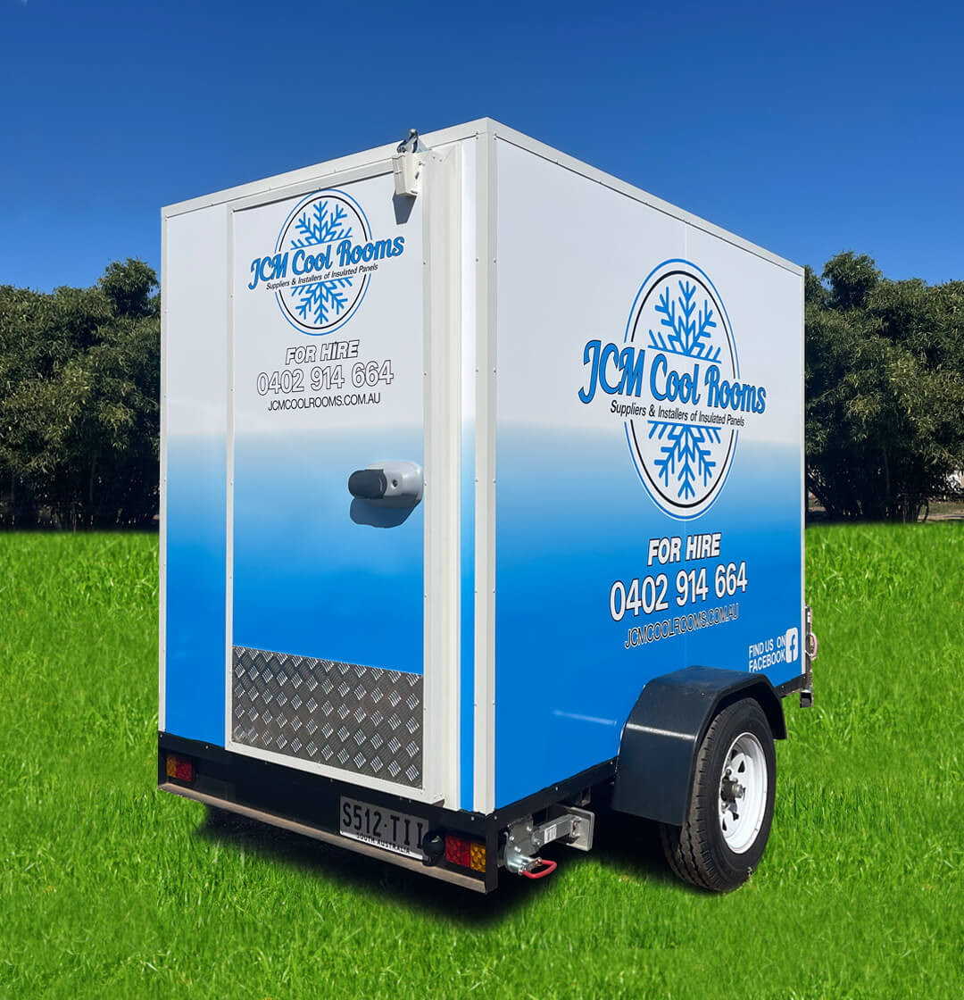 JCM Cool Rooms - Mobile Cool Room Hire Adelaide. A photo of one of their mobile cool rooms parked on a large grass area.